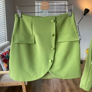 Shein green mini skirt with button and pocket detail - size L